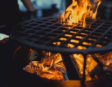 barbecue grill, close - up. professionally cooking food on an open fire on a cast-iron grate.